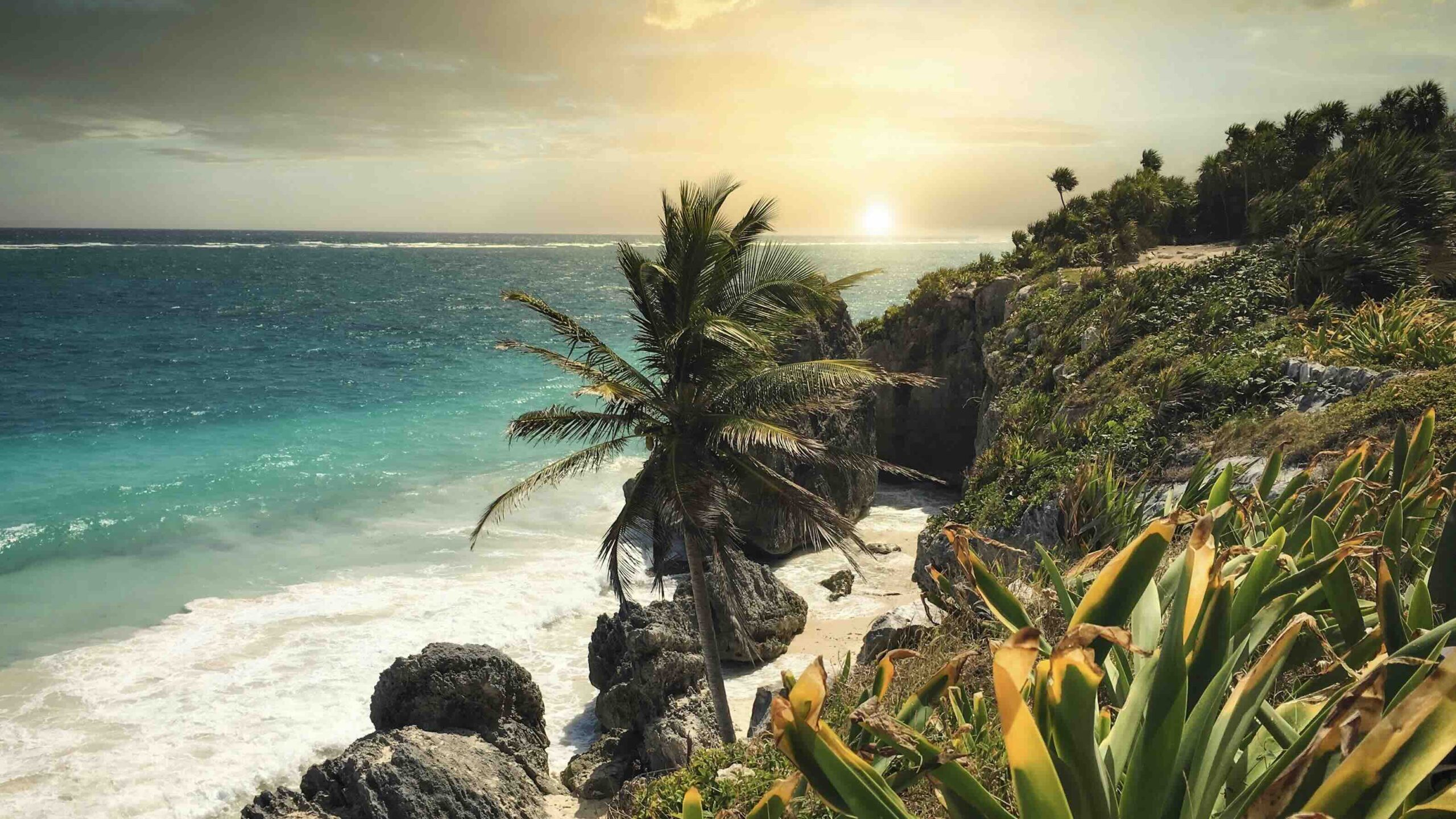 Tulum Ruins in Tulum Mexico. Sunset at a beautiful beach in Tulum Mexico Darren Lawrence- UNsplash Luxury Riviera Maya