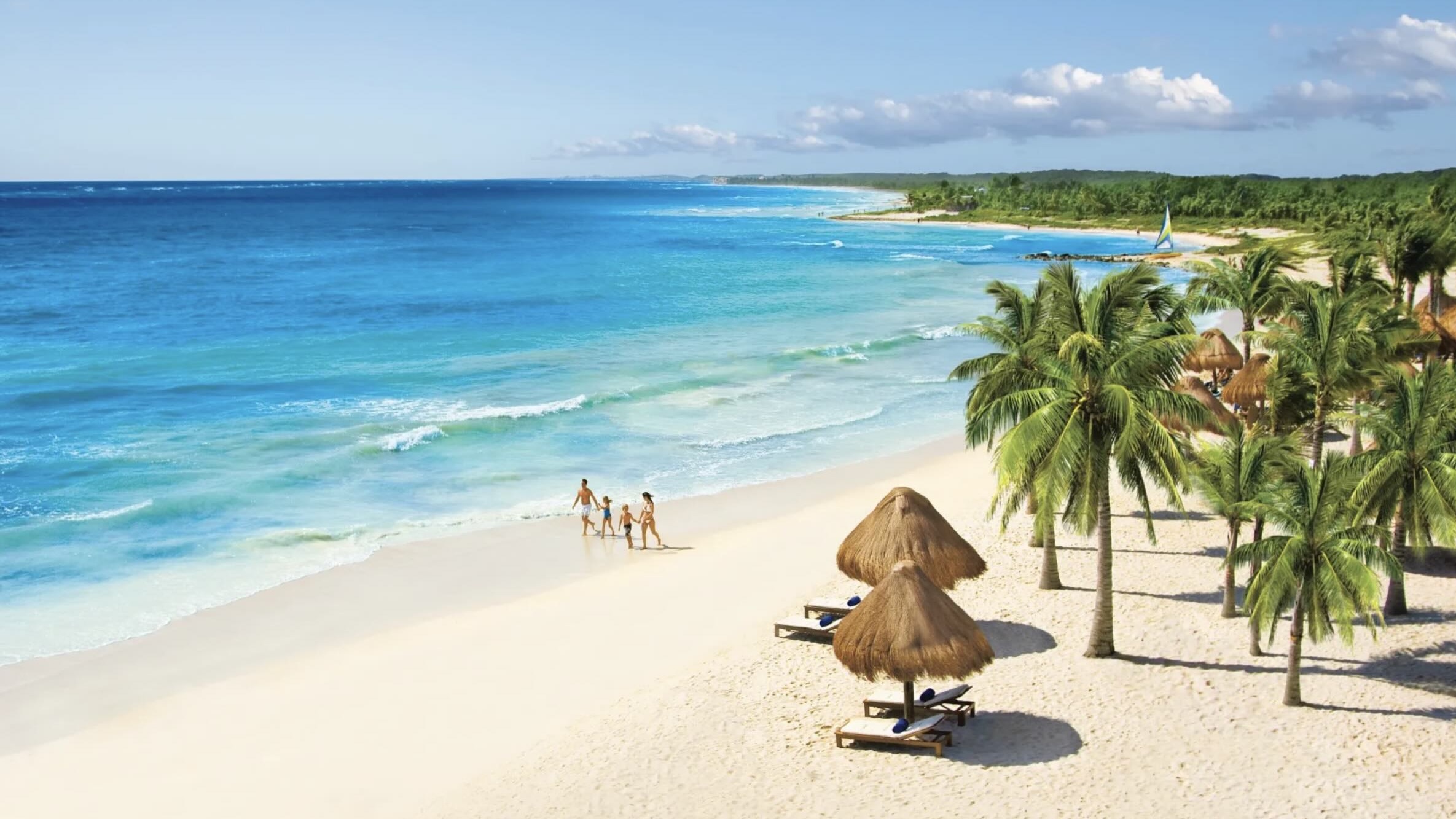 Dreams Tulum Resort & Spa family running across beach at one of the best all-incusive resorts in Tulum Mexico