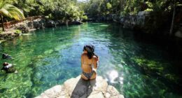 jorge-fernandez-salas-Mexican Caribbesan Travel woman sitting on rockunsplash