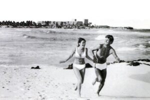 People running on beach in Riviera Maya