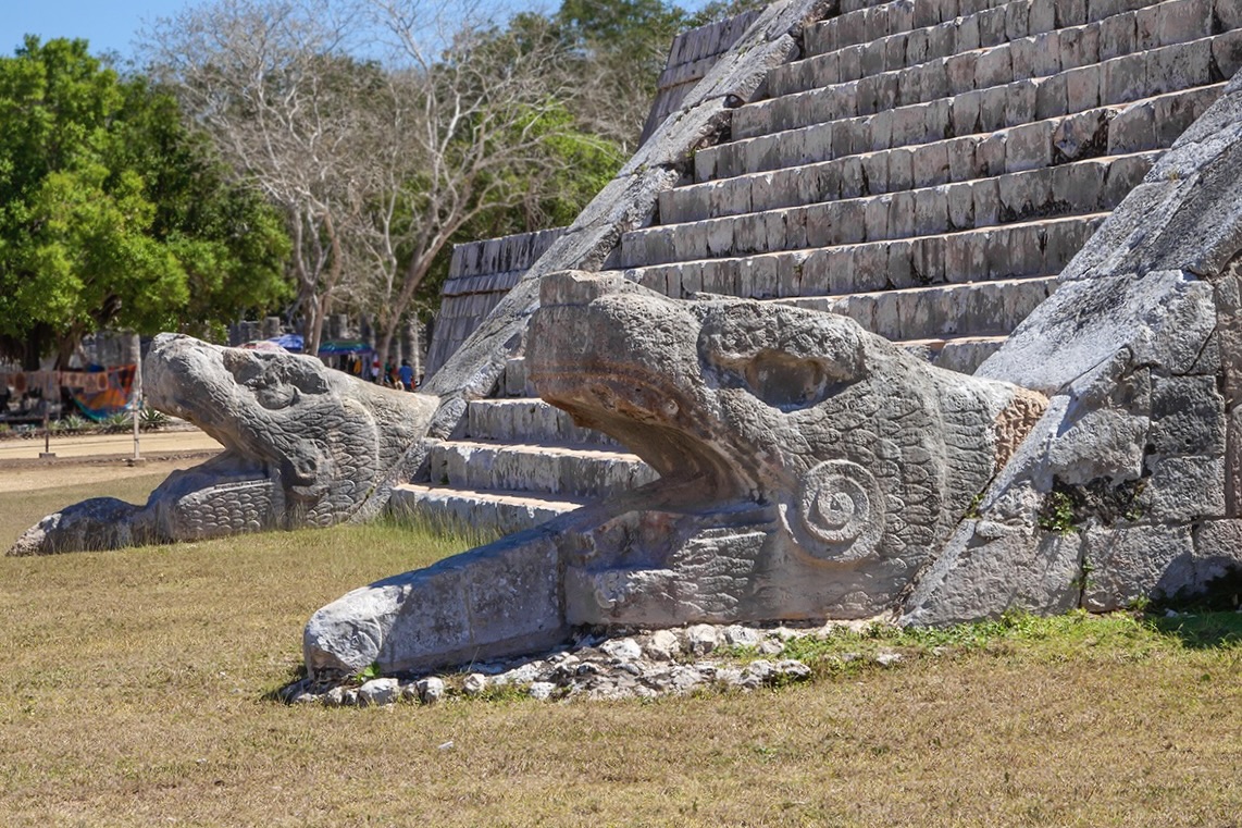 Steps and snake heads at the bottom of the Pyramid of Kukulcan at Chichen Itza, in Yucatan province in Mexico a Unesco site