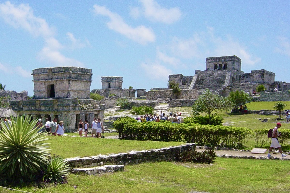 View of Tulum archaeological site with the Temple of the Frescoes in the foreground and the Castillo in the background. Photo Carlos Rosado van der Gracht